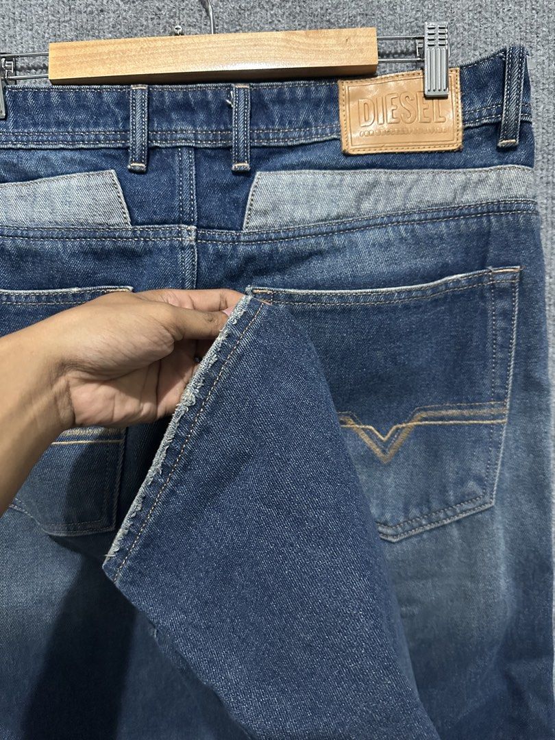 Diesel Blue Denim Jeans (Category: Jeans) located in Villasis. Submitted by justinramosonfb (Listing ID 1467121283, Image 2). Description: - Brand: Diesel - Color/Wash: Blue denim with faded wash - Fit: Straight leg with slight distressing at hem edges - Closure: Classic button fly - Details: Contrast stitching, front pockets, classic back pockets, and rear leather brand patch - Condition: Sturdy denim fabric with interior brand tags.