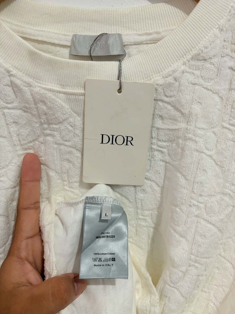 Dior Embossed Monogram Terry Cloth T-Shirt White (Category: Tshirts & Polo Shirts ) located in Daraga. Submitted by argarinang25024 (Listing ID 1467032695, Image 3). Description: - Brand: Dior - Style: Crew neck short sleeve tee with embossed monogram pattern - Material: 100% cotton textured terry cloth - Condition: Brand new with original tags attached - Size: Large - Origin: Made in Italy - Color: Clean white with a soft, plush feel - No issue 