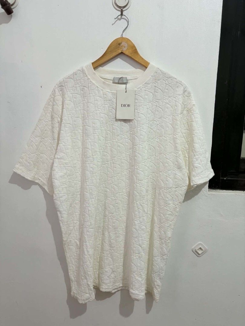 Dior Embossed Monogram Terry Cloth T-Shirt White (Category: Tshirts & Polo Shirts ) located in Daraga. Submitted by argarinang25024 (Listing ID 1467032695, Image 1). Description: - Brand: Dior - Style: Crew neck short sleeve tee with embossed monogram pattern - Material: 100% cotton textured terry cloth - Condition: Brand new with original tags attached - Size: Large - Origin: Made in Italy - Color: Clean white with a soft, plush feel - No issue 