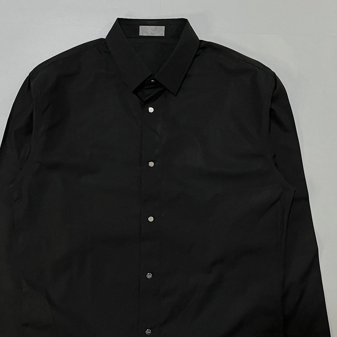 DIOR HOMME BUTTON UP SHIRT (Category: Luxury Apparel) located in Bacolod City. Submitted by the.finest (Listing ID 1467107031, Image 2). Description: Dior Homme CD Logo Metal Snap Button up Shirt Tag Size: 38 Width: 20 Length: 30-31 Condition: 9/10 7,000+shipping fee.