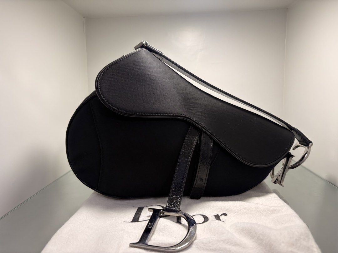 Dior Saddle Nylon John Galliano Era Circa 2001🖤 (Category: Luxury Bags & Wallets) located in Navotas City. Submitted by heiresslovecloset (Listing ID 1467086472, Image 1). Description: Dior Saddle Nylon John Galliano era* 200 Rare and collectible piece comes with dustbag .