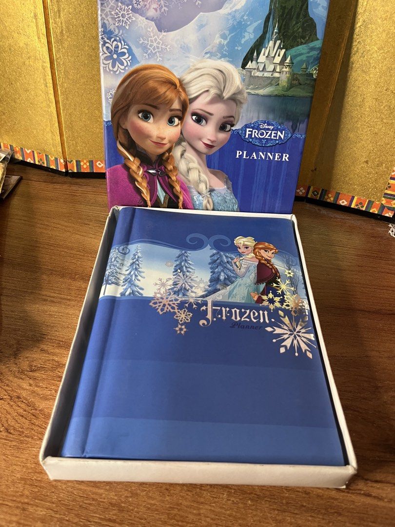 Disney Frozen Planner with Original Box (Category: Stationery & School Supplies) located in Gapan. Submitted by lunashop14 (Listing ID 1467095196, Image 1). Description: - Official Disney Frozen planner by Sterling Paper - Comes with a beautiful matching presentation box - 100% unused and ready to be filled out - Spiral-bound with cute themed headers (e.g., May, June) - Charming snowflake borders on every page - Great find for Disney fans and col