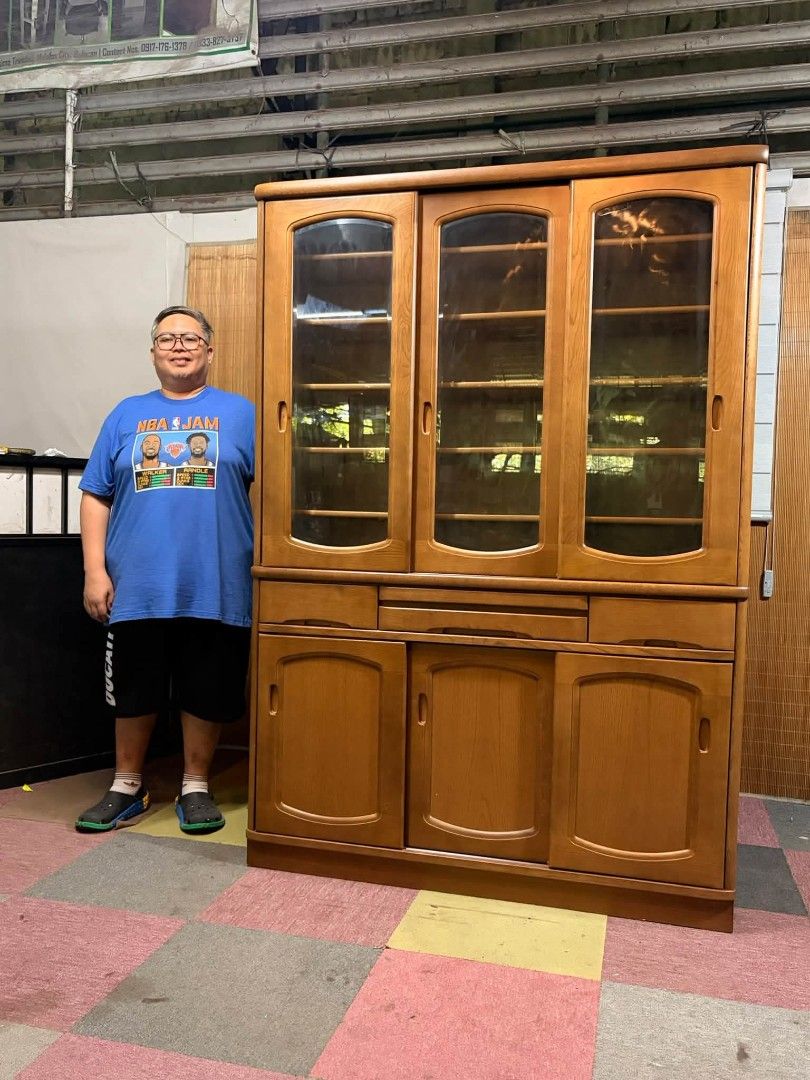 Display Cabinet (Category: Shelves, Cabinets & Racks) located in Meycauayan. Submitted by marygracecasimiro (Listing ID 1467007448, Image 3). Description: KARIMOKU Elegant SLIDING DOORS Cabinet SOLID WOOD!!! VERY HEAVY!!! MAKINIS!!! Very Big Display Cabinet, Cupboard, Platera Vintage Mid-Century Design Diamond cut Glass Doors, Adjustable Shelves This classic piece features a two-tiered design, including an upper hutch with three arched glass slid