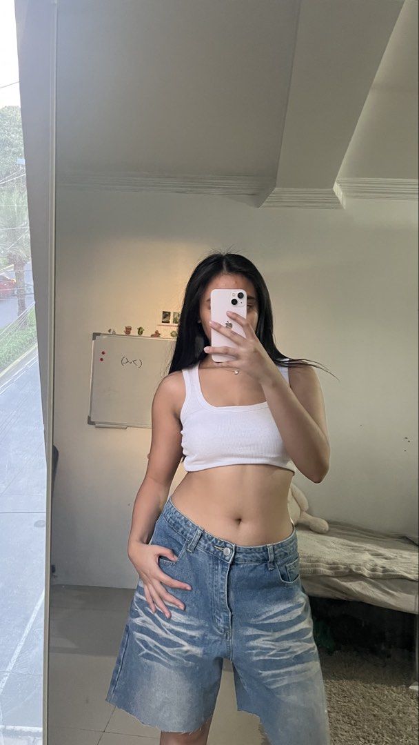 Distressed Denim Jorts Oversized Blue Shorts (Category: Shorts) located in Manila. Submitted by iayo.15 (Listing ID 1467070361, Image 1). Description: - Mid-wash denim shorts hitting right at the knees - Relaxed, baggy fit with distressed whiskering on the front - Raw-edge hems and standard button-zip fly with belt loops - Classic five-pocket styling - Made from thick, durable denim material - Perfect for casual streetwear paired with crop tops o
