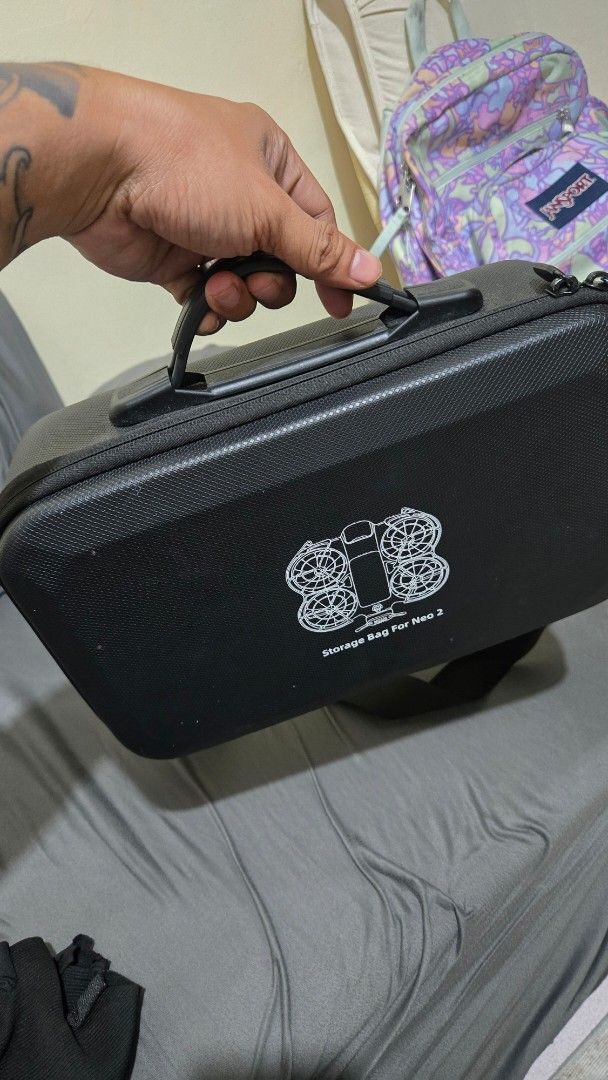 DJI Neo 2 drone storage bag and remote controller (Category: Drones) located in Manila. Submitted by fafamoto (Listing ID 1467056711, Image 1). Description: - Custom fit for DJI Neo 2: Safely holds drone, controller, and up to 3 batteries , and transceiver - Extra storage: Includes space for spare propellers packed in sealed plastic - Ultimate protection: Tough hard shell exterior guards against bumps and drops - Organized interior: Precision foa