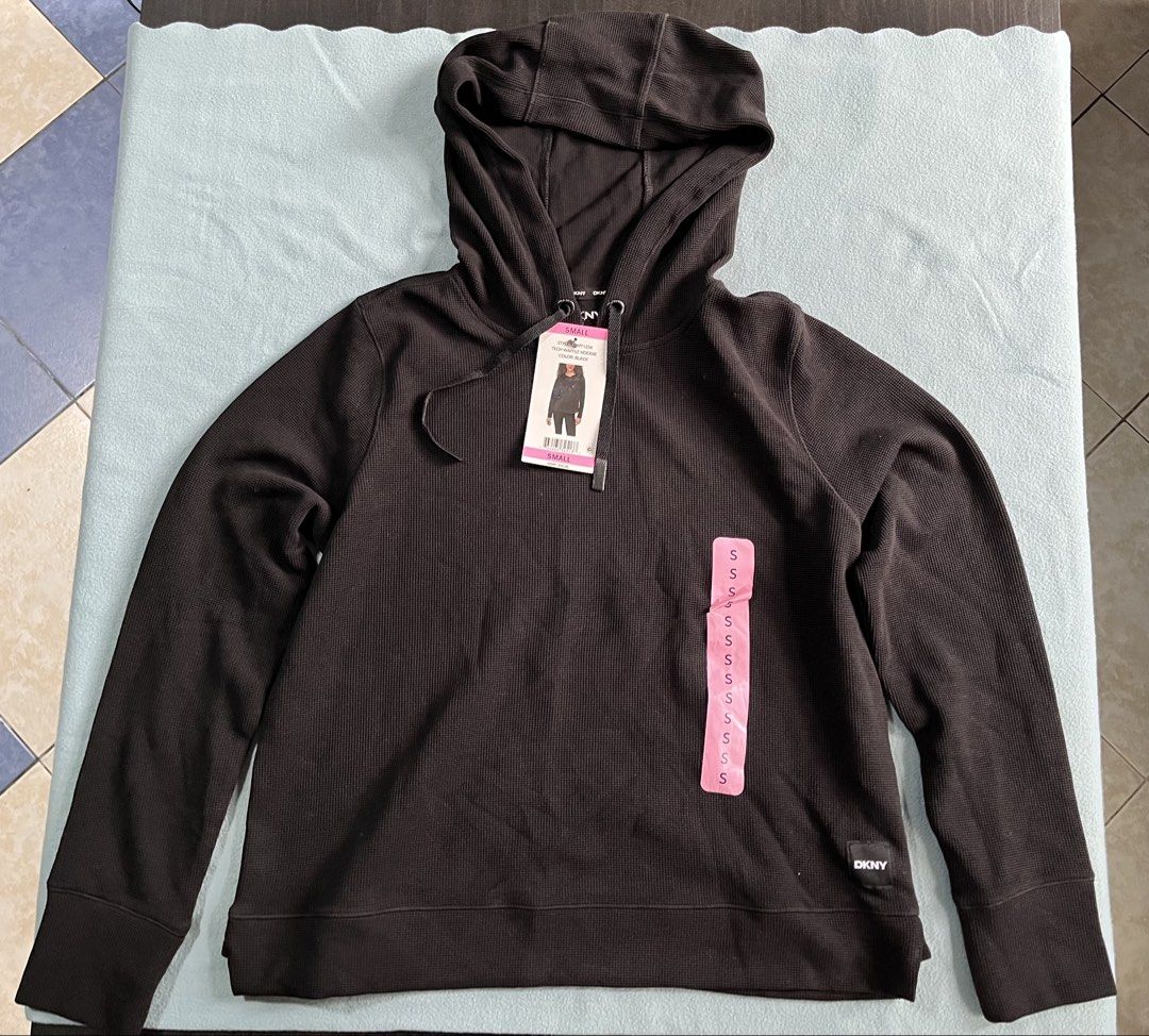 DKNY Tech Waffle Hoodie Black (Category: Coats, Jackets and Outerwear) located in Manila. Submitted by sunshineapril (Listing ID 1466978478, Image 1). Description: - Brand: DKNY - Item: Tech Waffle Hoodie - Color: Solid Black - Condition: Brand new with tags (BNWT), never worn - Details: Long sleeves, relaxed hood, matching drawstrings with metal tips, and subtle logo tag near hem - Original Retail Price: $59.00.