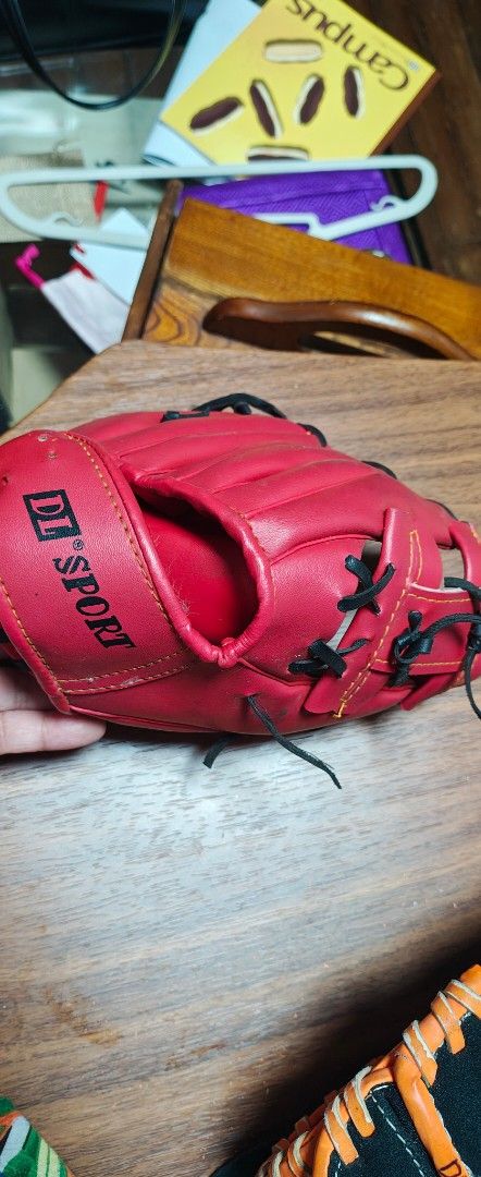 DL Sport Red Baseball Glove (Category: Racket and Ball Sports) located in Manila. Submitted by teng_d (Listing ID 1467164810, Image 1). Description: - Brand/Model: DL Sport baseball glove - Color & Style: Bright red with contrasting black lacing - Build: Hand-crafted, performance-designed palm lettering - Web Design: Traditional web with adjustable wrist strap - Orientation: Standard right-hand thrower setup - Condition: Ready for your next game 