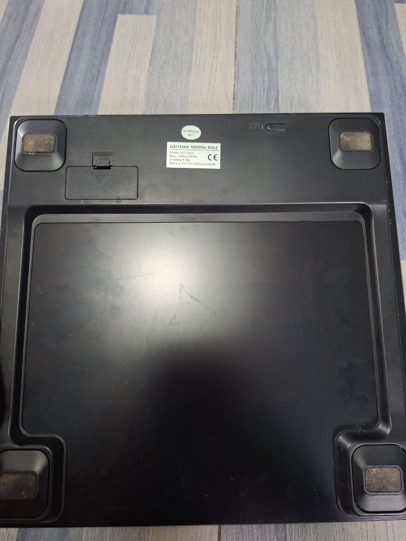 Dowell Electronic Personal Scale BSD-8155 (Category: Health Monitors & Weighing Scales) located in Manila. Submitted by ninyagauri24333 (Listing ID 1467011191, Image 2). Description: Dowell electronic personal scale, model BSD-8155. Stainless steel top platform with digital display window. Black plastic underside with four corner feet and battery compartment. Uses two AAA batteries. Surface shows rust spots and scratches from regular use. Works f
