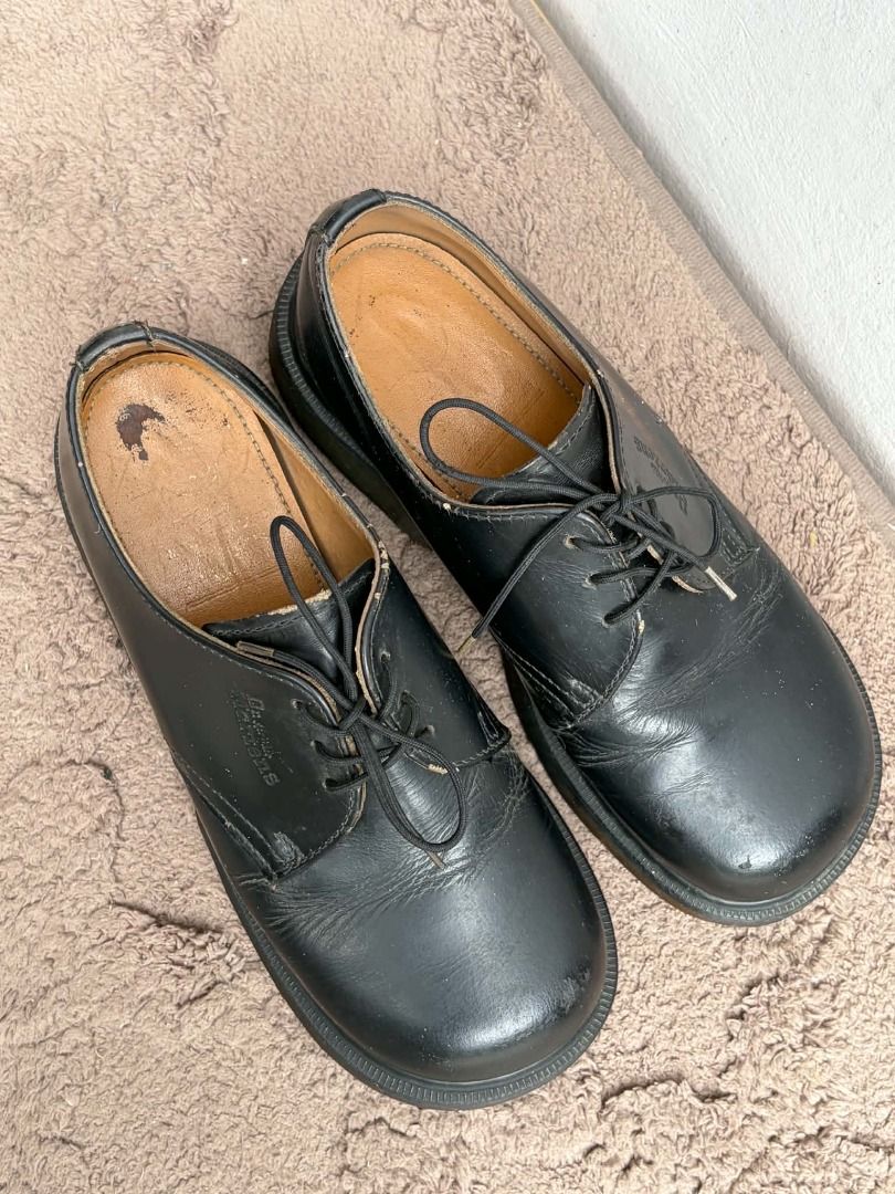 Dr. Martens Black Platform Derby Shoes (Category: Loafers) located in Naguilian. Submitted by vincesebastian (Listing ID 1467068589, Image 3). Description: - Brand: Dr. Martens - Made in England - Style: Black leather platform shoes with chunky soles and lace-up closure - Design: Classic round toe with stamped logo near the laces - Condition: Good, solid build with natural leather creasing from normal wear - Flaws: Light wear on the inner lining,