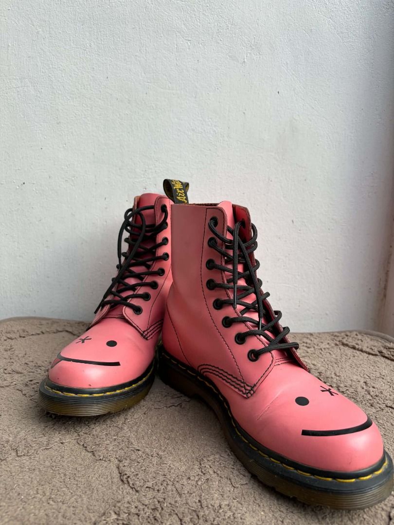 Dr. Martens Pink Custom Smiley Face Boots (Category: Boots) located in Naguilian. Submitted by vincesebastian (Listing ID 1467066458, Image 1). Description: NEGOTIABLE Dr Martens Hincky Acid Hot Pink Smile Wink Boots Rare Smiley - Brand: Dr. Martens - Style: Classic 8-eye boot in pink - Customization: Hand-painted smiley faces on toes (one winking with tongue out) - Details: Classic yellow welt stitching, black laces, and original heel loops - Co