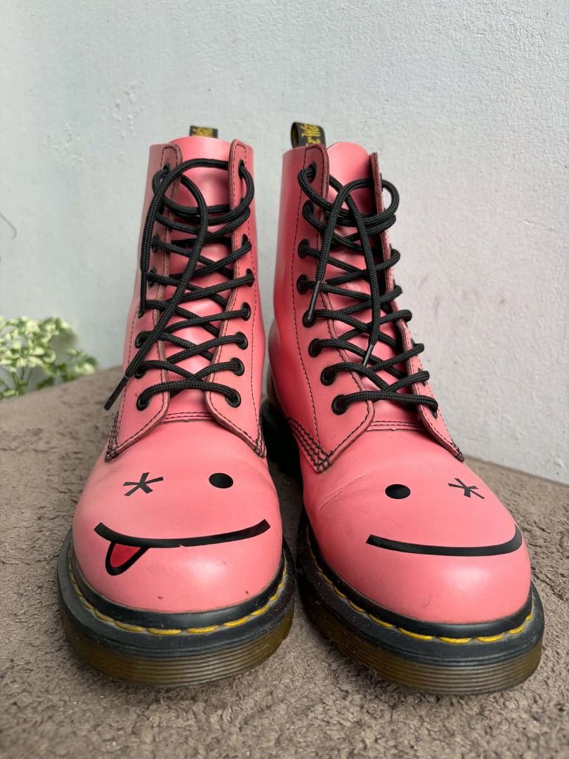 Dr. Martens Pink Custom Smiley Face Boots (Category: Boots) located in Naguilian. Submitted by vincesebastian (Listing ID 1467066458, Image 2). Description: NEGOTIABLE Dr Martens Hincky Acid Hot Pink Smile Wink Boots Rare Smiley - Brand: Dr. Martens - Style: Classic 8-eye boot in pink - Customization: Hand-painted smiley faces on toes (one winking with tongue out) - Details: Classic yellow welt stitching, black laces, and original heel loops - Co