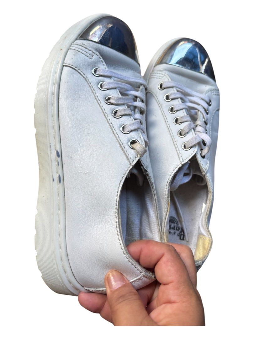 Dr. Martens White Metallic Cap Toe Leather Sneakers (Category: Sneakers) located in Lapu-Lapu City. Submitted by XueBaiGuang (Listing ID 1467062953, Image 3). Description: - Brand: Dr. Martens - Color: White with silver metallic cap toes - Style: Chunky platform sneakers with white laces and debossed tongue logo - Interior: Branded Dr. Martens insoles - Condition: Pre-loved with minor scuffs on the silver toes and slight wear inside the collars -
