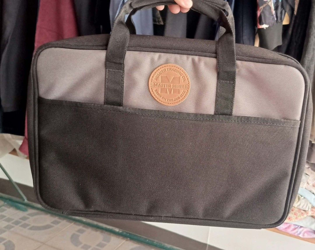 Duluth Trading Co Master Series Briefcase Laptop Bag (Category: Briefcases) located in Dimasalang. Submitted by tinzstory (Listing ID 1466972789, Image 1). Description: • Brand & Model: Duluth Trading Co. Master Series (Authentic US brand) • Material & Design: Thick canvas material with a leather brand logo patch and multiple organized compartments for a laptop, documents, and office essentials. • Condition: Preloved/Used. Has some storage dust t