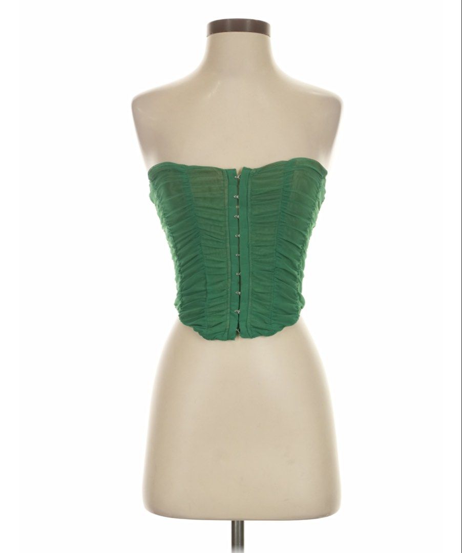 Edit by Nine Green Ruched Corset Top with Boning (Category: Sleeveless) located in General Tinio. Submitted by strawberrieees (Listing ID 1467071069, Image 1). Description: - Brand: Edit by Nine - Size: Small - Color: Green with nude lining - Material: Ruched mesh overlay - Closure: Front hook-and-eye with full back zipper - FIXED PRICE‼️ - MOP: Gcash -J&T Only.