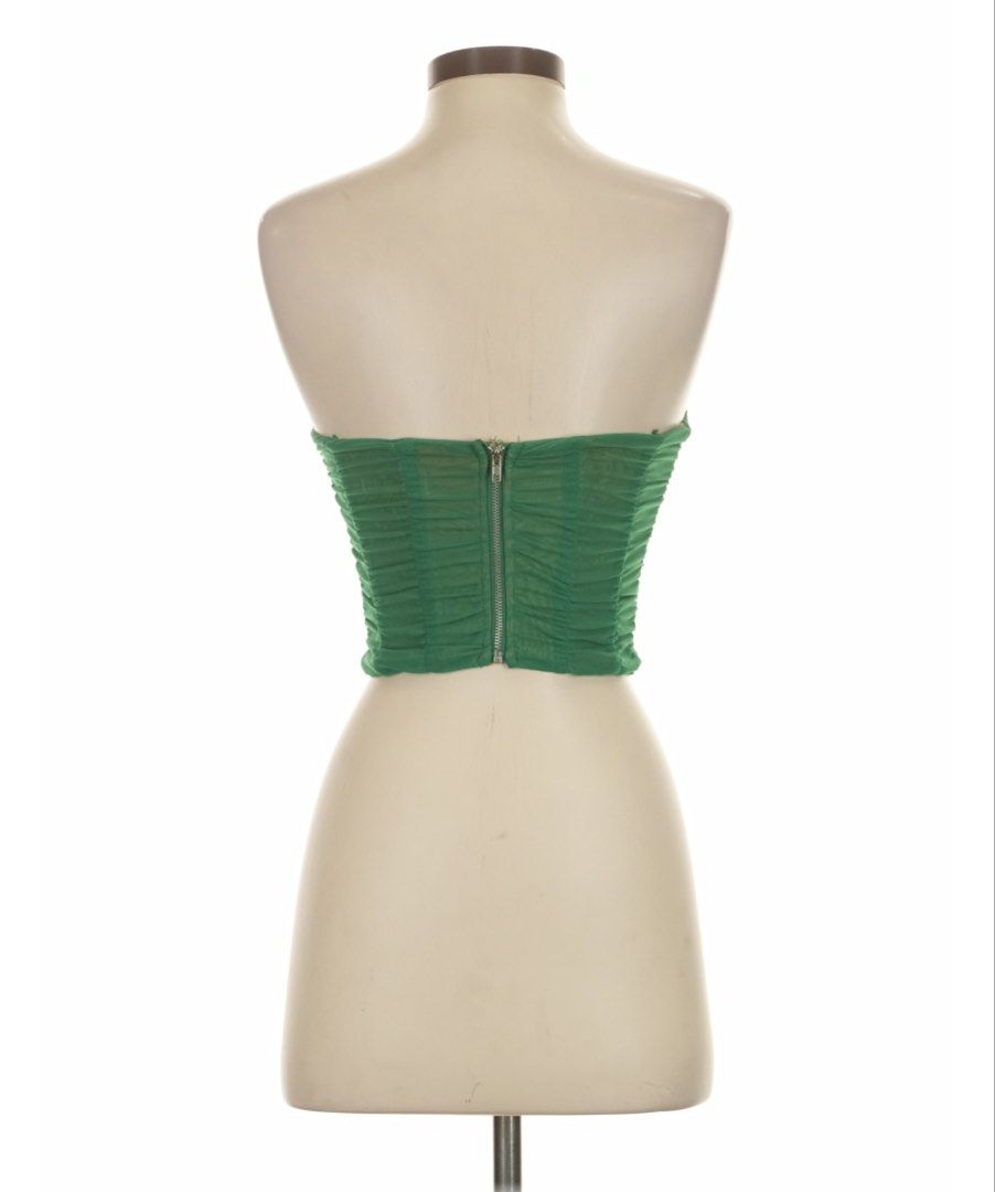 Edit by Nine Green Ruched Corset Top with Boning (Category: Sleeveless) located in General Tinio. Submitted by strawberrieees (Listing ID 1467071069, Image 2). Description: - Brand: Edit by Nine - Size: Small - Color: Green with nude lining - Material: Ruched mesh overlay - Closure: Front hook-and-eye with full back zipper - FIXED PRICE‼️ - MOP: Gcash -J&T Only.