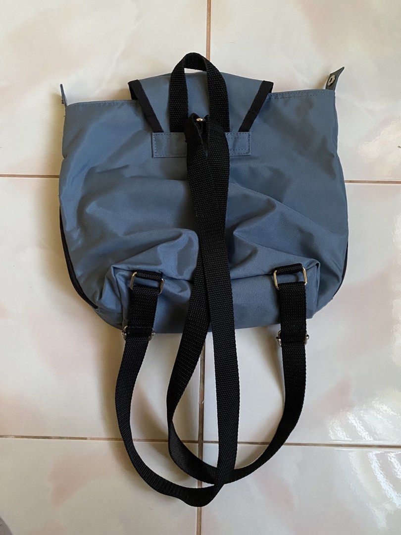 Ellesse Blue Nylon Mini Backpack (Category: Backpacks) located in Cagayan de Oro. Submitted by _tstudiooo (Listing ID 1467041894, Image 3). Description: Brand: Ellesse Color: 10/10 Vibrant blue with black adjustable straps Storage: Main compartment with flap closure, front zipped pocket, and convenient zippered side pockets Material: Durable nylon built for everyday wear and tear Style: Compact size with minimal branding tags on the front and sid