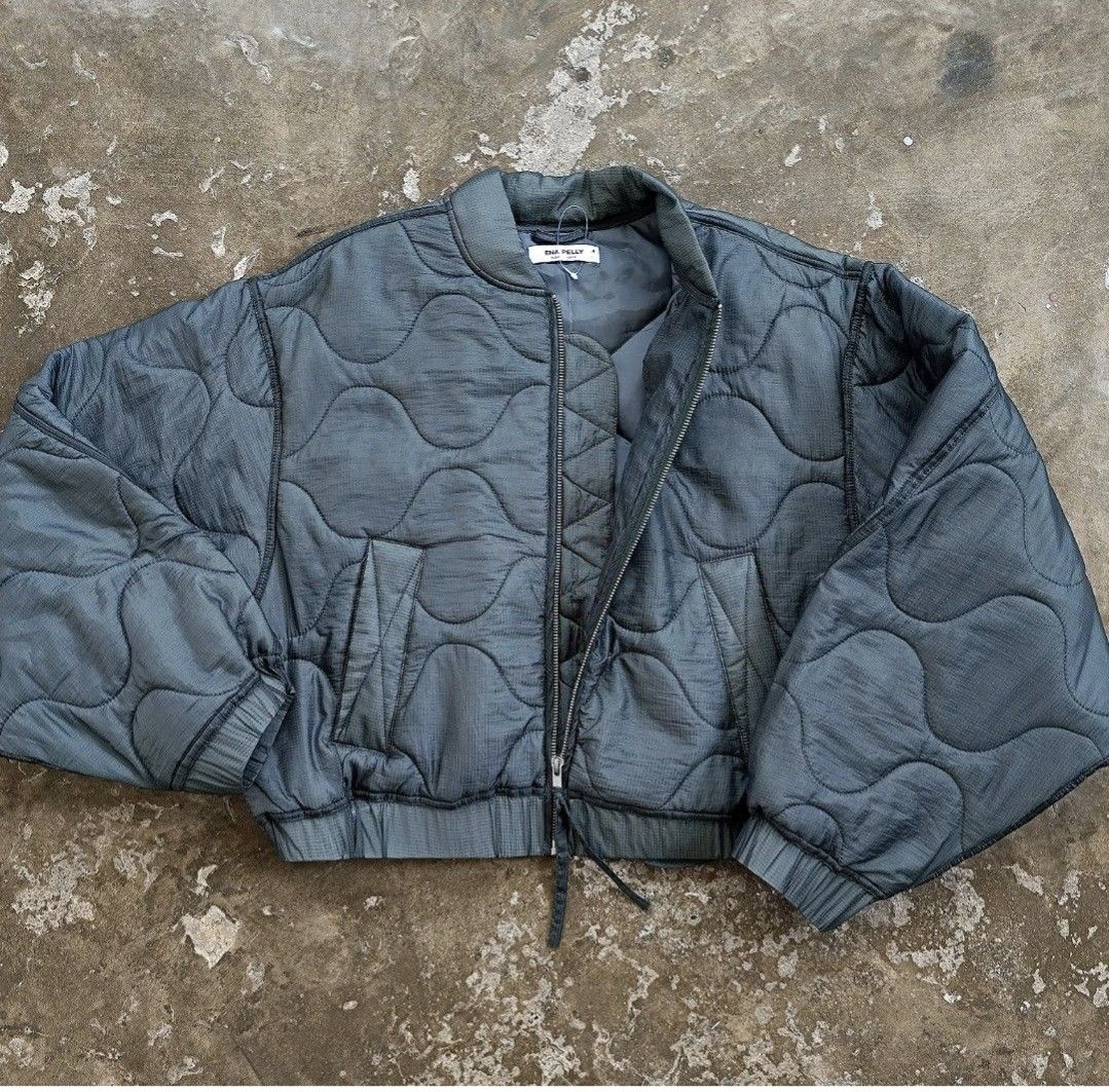 Ena Pelly Quilted Bomber Jacket - size S/M (Category: Coats, Jackets and Outerwear) located in Taguig. Submitted by piecesforless (Listing ID 1467051985, Image 2). Description: - Brand: Ena Pelly - Color: metallic Green - Design: All-over wave pattern stitching with thick padded construction - Fit: Cropped with voluminous sleeves - Features: Full zip closure with dual zippers, ribbed collar, cuffs, and hem, plus slanted front pockets - Condition: