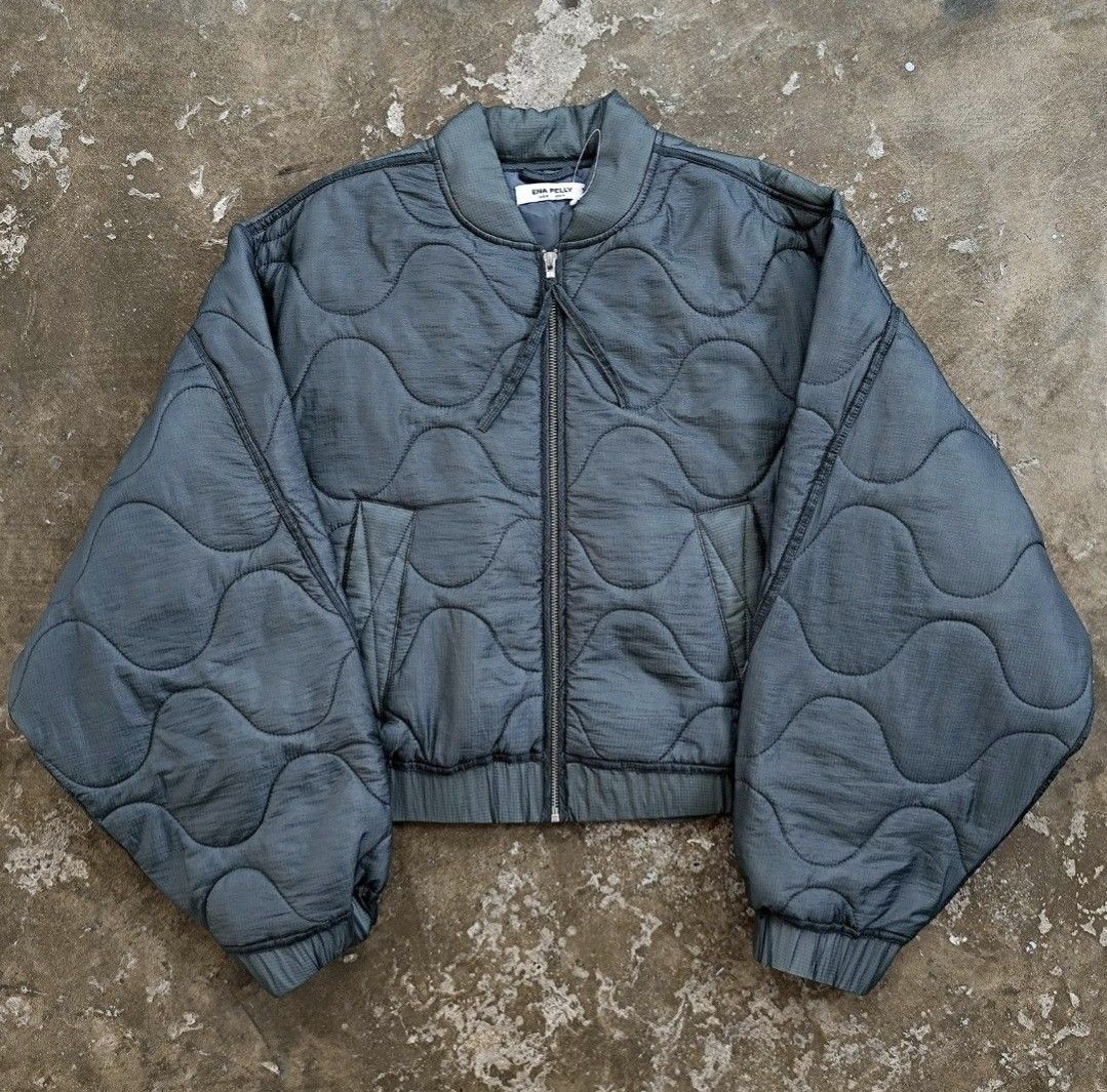 Ena Pelly Quilted Bomber Jacket - size S/M (Category: Coats, Jackets and Outerwear) located in Taguig. Submitted by piecesforless (Listing ID 1467051985, Image 1). Description: - Brand: Ena Pelly - Color: metallic Green - Design: All-over wave pattern stitching with thick padded construction - Fit: Cropped with voluminous sleeves - Features: Full zip closure with dual zippers, ribbed collar, cuffs, and hem, plus slanted front pockets - Condition: