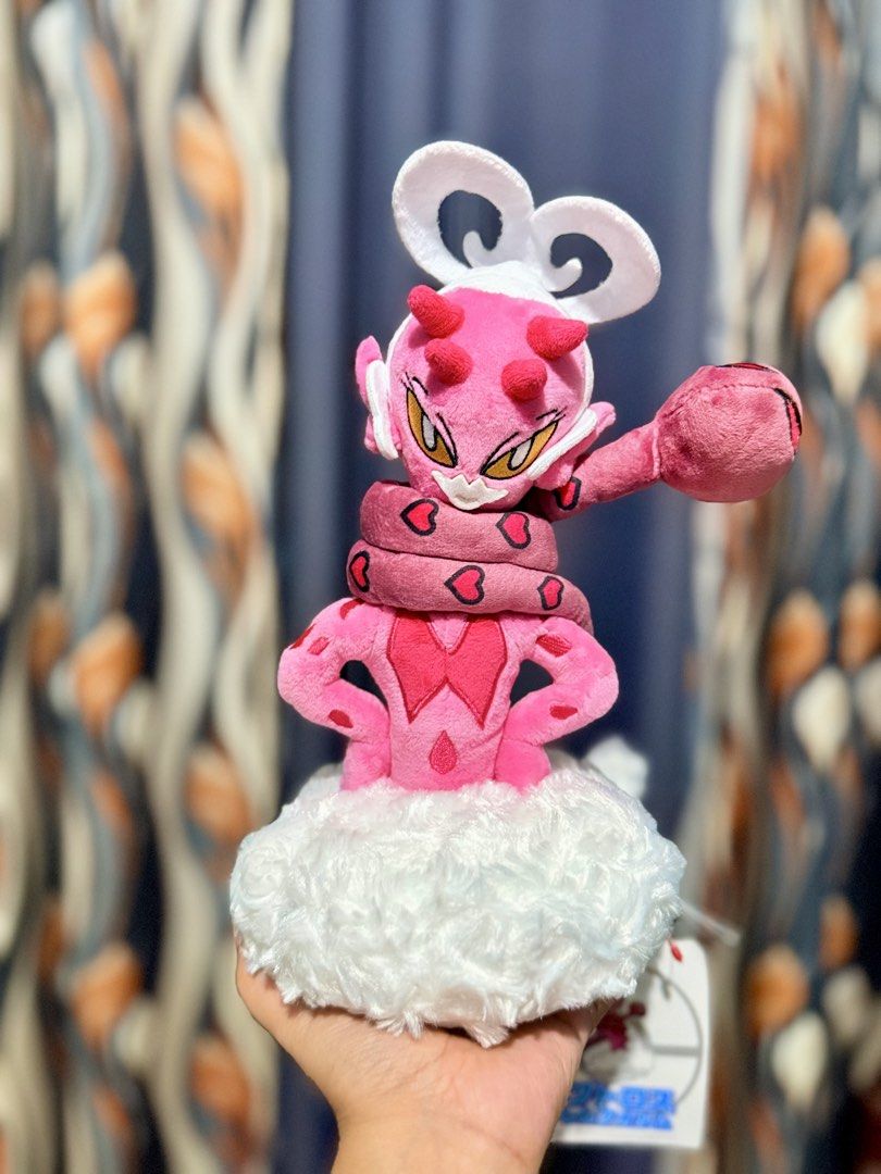 Enamorus Pokemon Plush (Category: Plushies & Soft Toys) located in Cavite. Submitted by projectplushie (Listing ID 1467133445, Image 1). Description: - Official Pokémon Center Enamorus Therian Forme plush - Vibrant pink body with cute heart-patterned ribbon - Stands on a fluffy white cloud base - Original tag still attached - Clean fabric and bright colors, ideal for any collection.