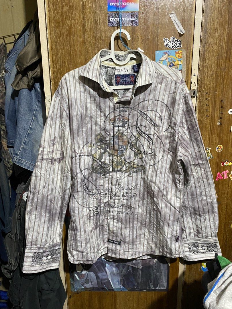 English Laundry Long Sleeve Striped Button Down Shirt (Category: Formal Shirts) located in Imus. Submitted by frootiloots4103 (Listing ID 1467153529, Image 1). Description: - Brand: English Laundry - Size: M - Material: 60% cotton, 40% polyester - Design: Grey and white stripes with unique graphic prints and chest embroidery - Details: Intricate embroidered cuffs and classic collar with paisley inner lining - Condition: Great statement piece pack