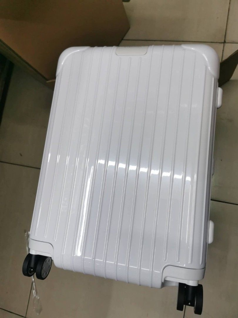 Essential White Cabin Luggage Suitcase (Category: Luggage) located in Manila. Submitted by dh3nz1 (Listing ID 1467063904, Image 2). Description: polycarbonate suitcase in pristine condition - Smooth 4-wheel multi-caster system and sturdy telescopic handle - Zip-around closure with built-in TSA-approved lock - Dual interior compartments with zipped mesh dividers and adjustable compression straps - Clean grey patterned fabric lining - Protective pl