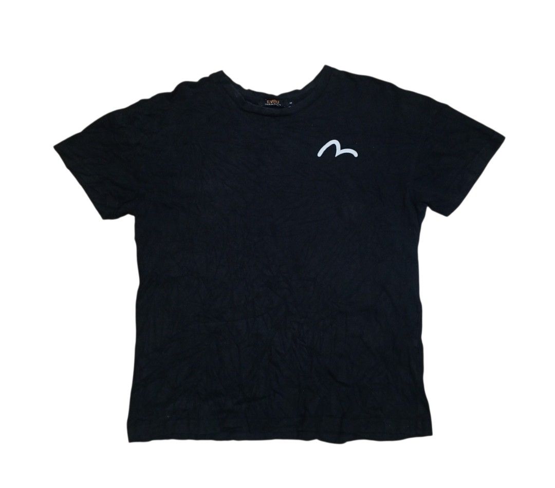 Evisu Black Graphic T-Shirt (Category: Tshirts & Polo Shirts ) located in Manila. Submitted by kents_thrift (Listing ID 1466971374, Image 1). Description: - Brand: Evisu Premium Quality - Color: Black - Size: 100 - Design: Small white seagull logo on left chest, large graffiti-style lettering across upper back, and round crest graphics on both sleeves - Authenticity: Includes official interior authentication label and collar tag.