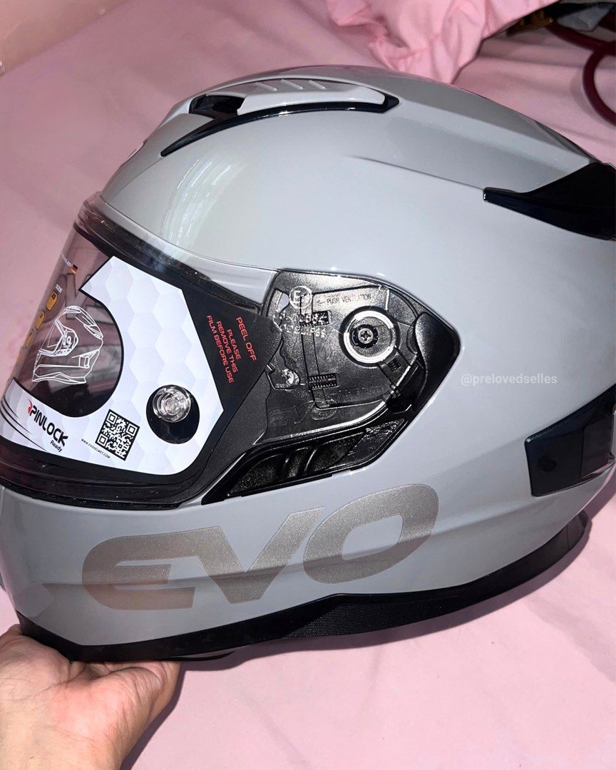 Evo AR-01 Full Face Motorcycle Helmet Gray (Category: Bicycles) located in Kawit. Submitted by prelovedselles (Listing ID 1467044795, Image 2). Description: Selling a brand new, completely unused EVO AR-01 full face helmet in cool gray. The plastic film is still on the visor. Specs: - Model: EVO AR-01 - Color: Cool Gray - Size: XXL on tag but can only fit 61-62cm (XL standard size) - Dual visor (outer clear lens and inner drop-down smoke visor) I