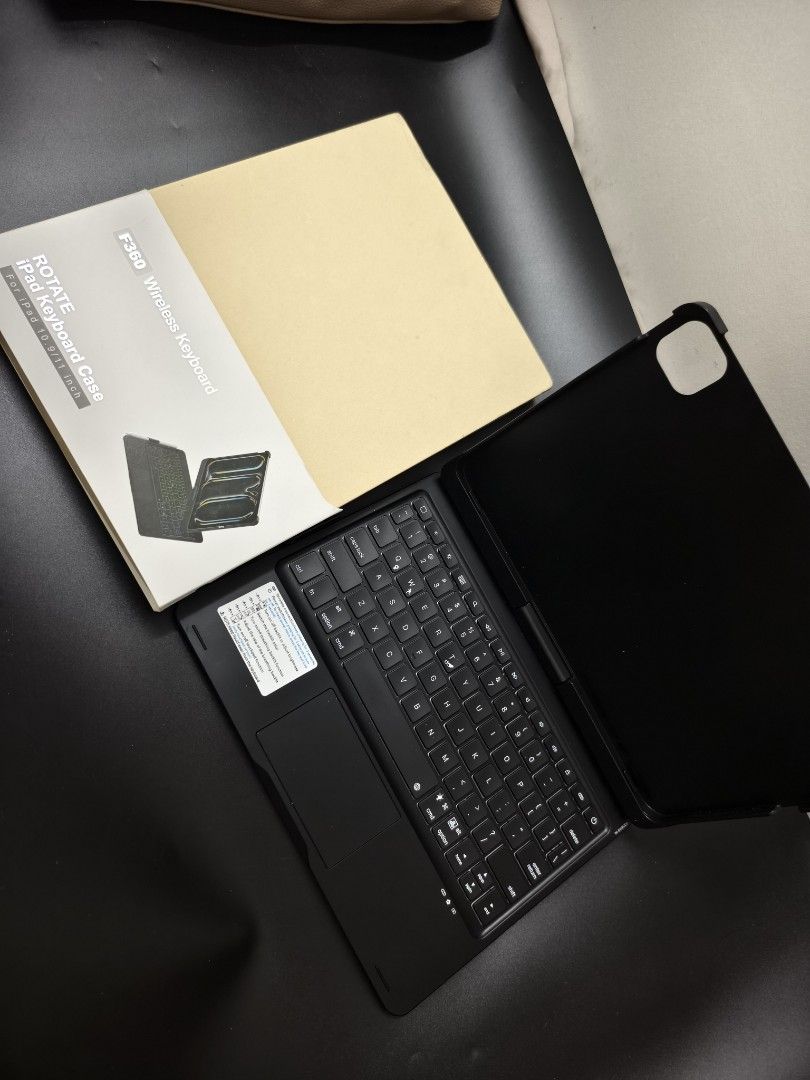 F360 Wireless Keyboard Case for iPad 10.9/11 inch (Category: Cases & Sleeves) located in Angeles City. Submitted by measaliman02351 (Listing ID 1467082787, Image 1). Description: - Compatibility: Fits iPad 10.9 and 11-inch models - Design: Black keyboard folio with 360-degree rotation structure - Features: Built-in trackpad and adjustable backlit keys - Condition: Clean, tested, and fully functional - Inclusions: Comes with original retail box - 
