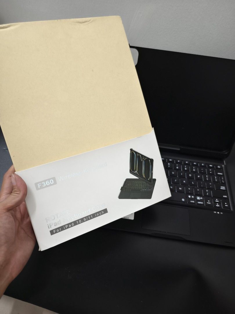 F360 Wireless Keyboard Case for iPad 10.9/11 inch (Category: Cases & Sleeves) located in Angeles City. Submitted by measaliman02351 (Listing ID 1467082787, Image 2). Description: - Compatibility: Fits iPad 10.9 and 11-inch models - Design: Black keyboard folio with 360-degree rotation structure - Features: Built-in trackpad and adjustable backlit keys - Condition: Clean, tested, and fully functional - Inclusions: Comes with original retail box - 