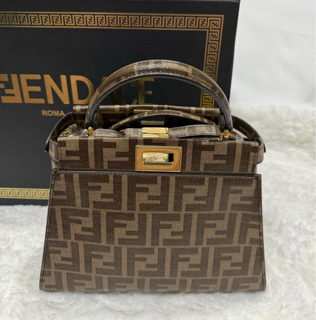 Fendi X Antonio Lopez Peekaboo (Category: Luxury Bags & Wallets) located in Manila. Submitted by jdywatches88 (Listing ID 1467025432, Image 2). Description: Fendi X Antonio Lopez Peekaboo handbag featuring the iconic brown Zucca canvas and a colorful pop-arr leather graphic.