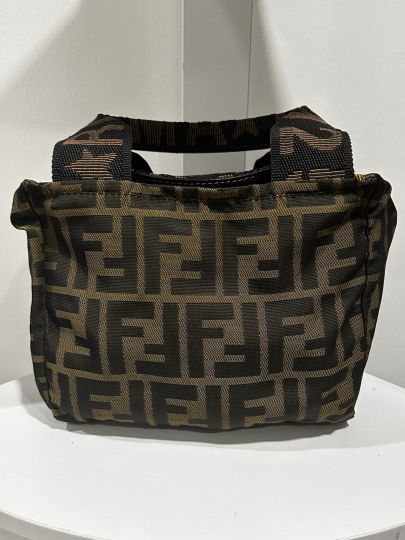 Fendi Zucca Print Mini Handbag (Category: Luxury Bags & Wallets) located in Rizal. Submitted by bebangel (Listing ID 1467100023, Image 1). Description: - Authentic Fendi handbag featuring the iconic brown and black Zucca monogram pattern - Compact and practical design, perfect for carrying daily essentials - Comfortable double fabric handles with stylish branded strap details - Secure top zipper closure equipped with a convenient leather pull tab