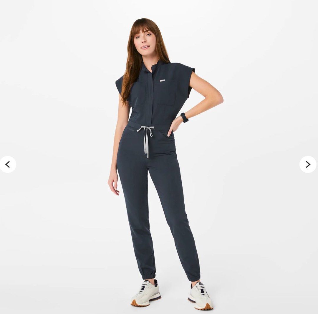 FIGS Jumpsuit (Category: Jumpsuits) located in Quezon City. Submitted by prelovedbylulu__ (Listing ID 1467003770, Image 1). Description: - Brand: FIGS - Adjustable drawstring waistband - Multiple utility pockets, including a side zippered pocket and a chest pocket with a pen slot - BRAND NEW; selling cause i got the wrong size 🥲.