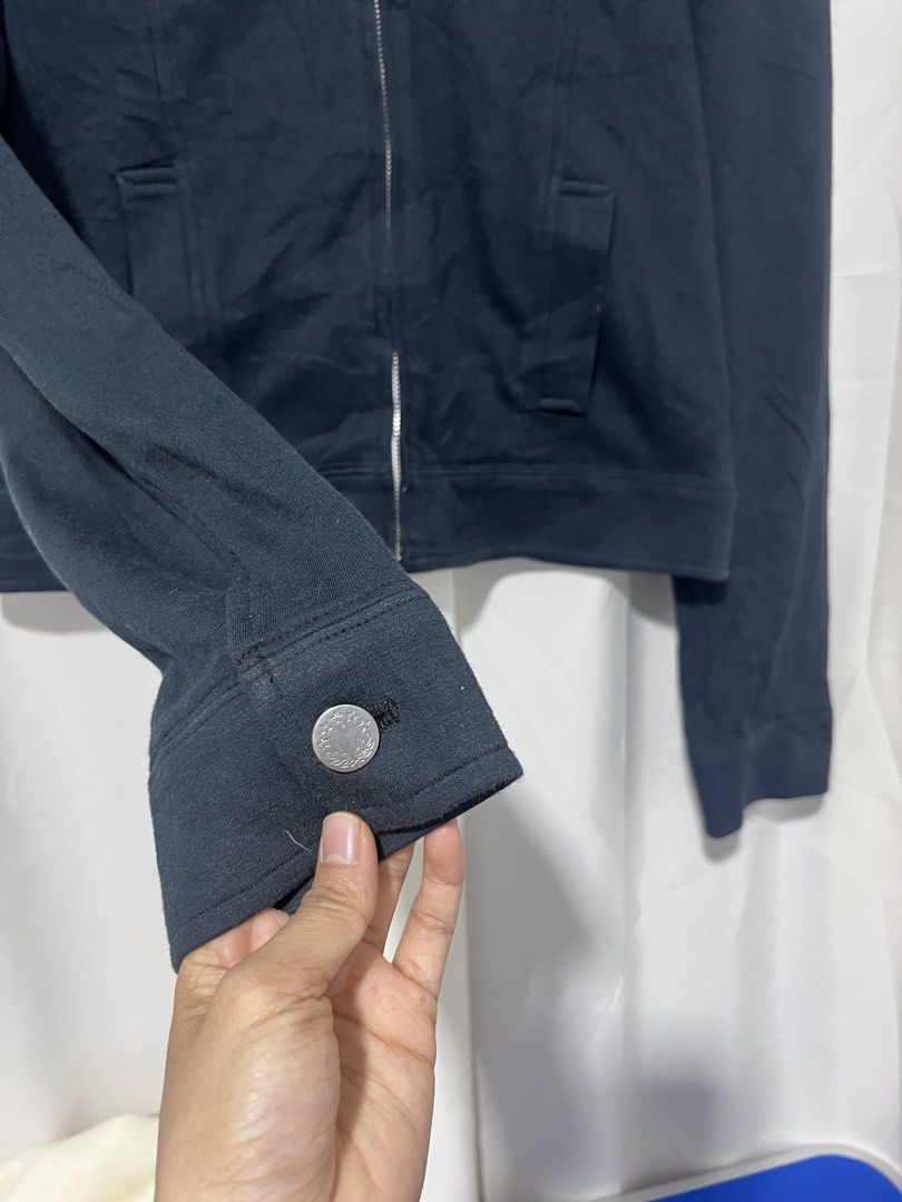 Fila Black Zip Up Jacket Size 160 (Small) (Category: Coats, Jackets and Outerwear) located in Baguio. Submitted by miisthyshop.ph (Listing ID 1467130551, Image 2). Description: - Brand: Fila - Color: Black - Size: 160 (fits Small) - Style: Zip-up jacket with classic collar and front buttoned chest pockets - Details: Custom Fila zipper pull and inner red, white, and blue stripe trim along the hem - Condition: Excellent pre-loved condition, clean a