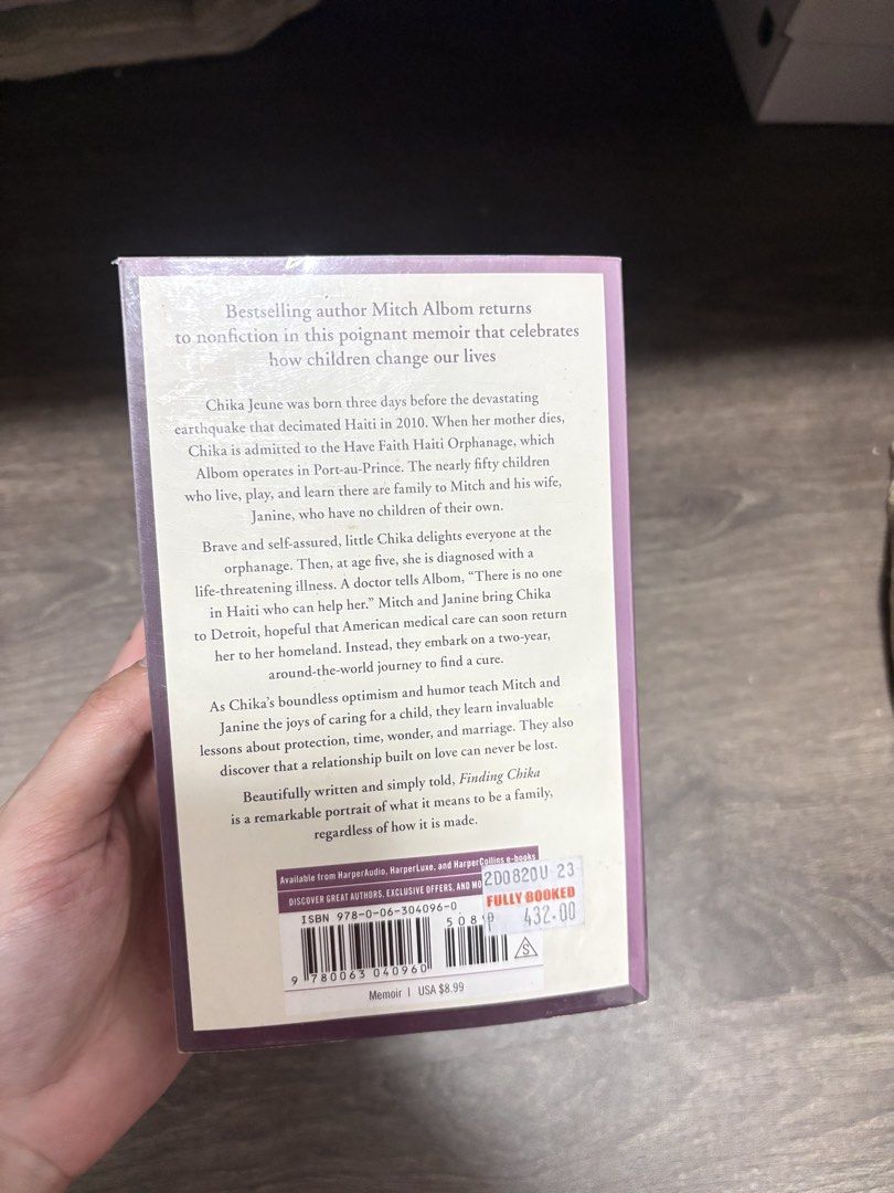 Finding Chika by Mitch Albom paperback memoir (Category: Storybooks) located in Imus. Submitted by _monicakes (Listing ID 1467097951, Image 3). Description: - Title: Finding Chika by Mitch Albom - Genre: Nonfiction / Memoir - Condition: Readable copy with mild yellowing from storage; spine is fully intact - Summary: A heartwarming and touching true story about a little girl from Haiti and the earthquake - Perfect for: Fans of inspiring and emotio