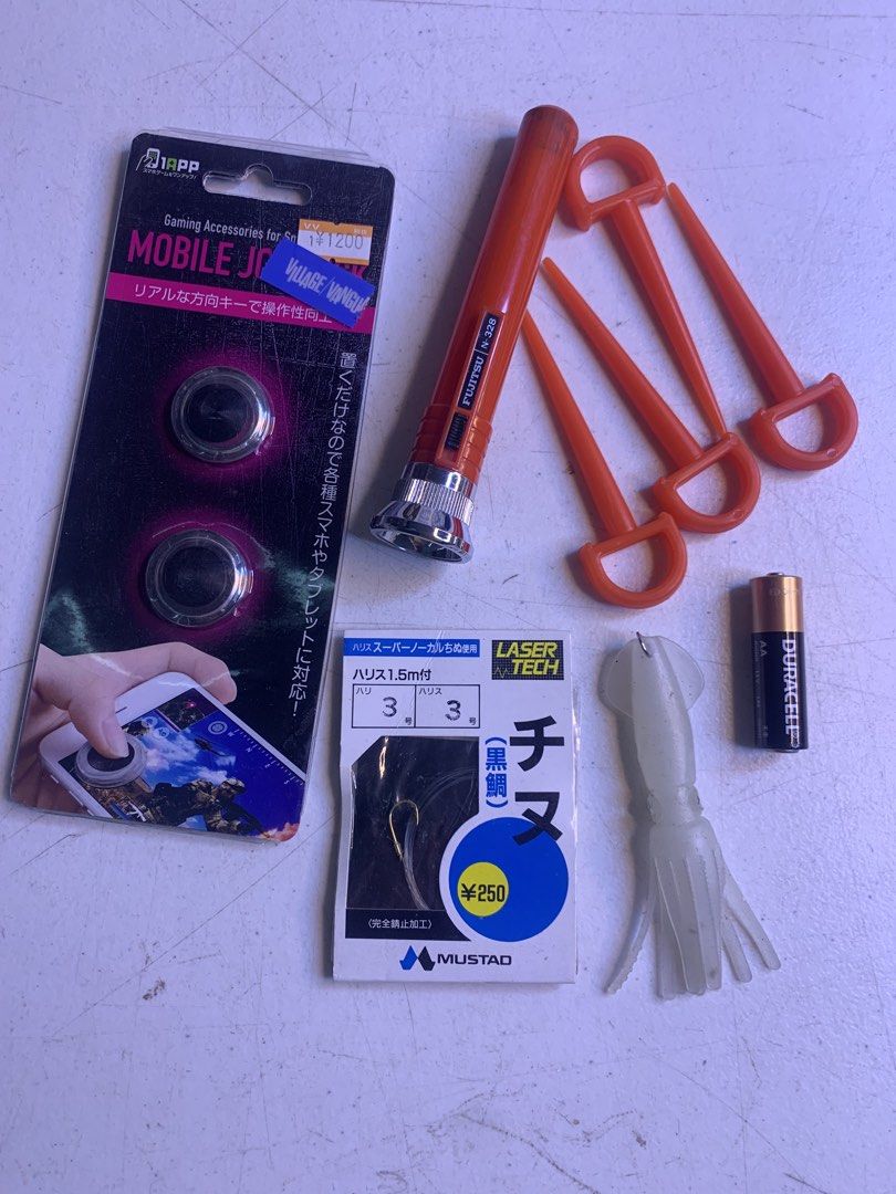Fishing and Camping Items (Category: Fishing) located in Carmona. Submitted by bihira (Listing ID 1467046165, Image 1). Description: Fishing and Camping Items - WYSIWYG - Tent Ground Pegs - Red (4pcs) - Fishing Hook and Squid Lure - Vintage Flashlight (working) - Mobile (Thumb) Joystick.