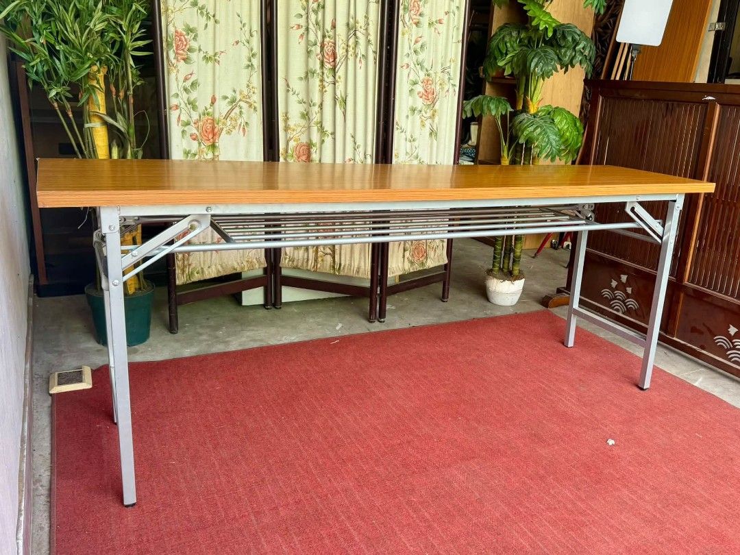 Folding Table (Category: Tables & Sets) located in Meycauayan. Submitted by marygracecasimiro (Listing ID 1467083883, Image 3). Description: Long‼️ Heavy Duty‼️ Multipurpose Folding Table Wood Top, Metal Legs 71”L x 18”W x 27”H Php 3,700 each 2 pieces available🩷.