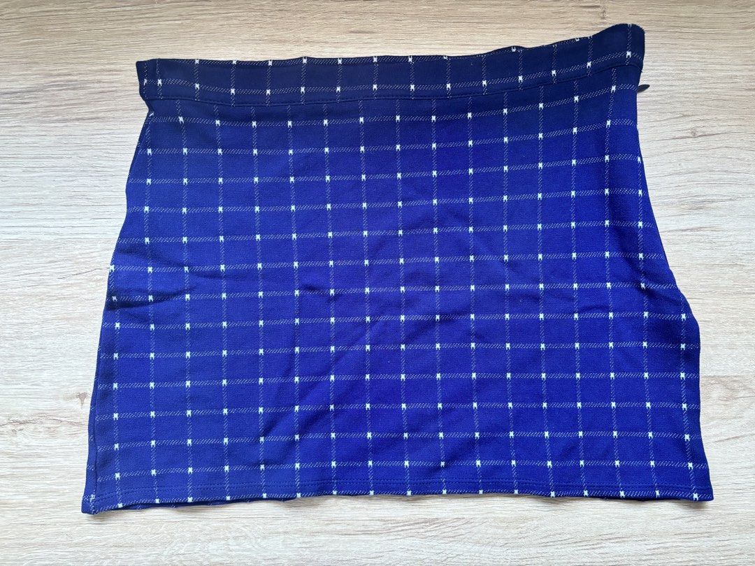 Forever 21 Blue Grid Pattern Mini Skirt Size S (Category: Skirts) located in Paranaque City. Submitted by ggg.bin (Listing ID 1466976214, Image 1). Description: - Brand: Forever 21 - Item: Blue mini skirt with white grid pattern - Size: S (fits true to size) - Material: Textured knit with structured waistband - Closure: Side zip - Condition: Excellent - Perfect casual piece, easy to pair with basic tees and sweaters.