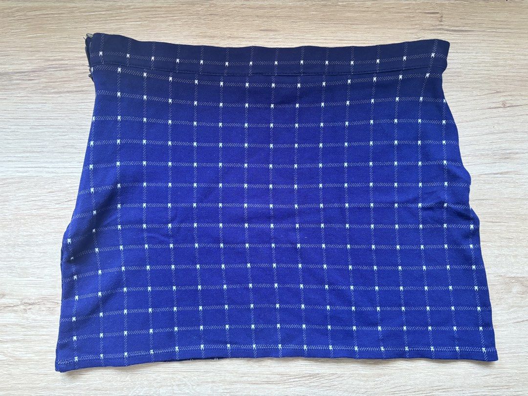 Forever 21 Blue Grid Pattern Mini Skirt Size S (Category: Skirts) located in Paranaque City. Submitted by ggg.bin (Listing ID 1466976214, Image 2). Description: - Brand: Forever 21 - Item: Blue mini skirt with white grid pattern - Size: S (fits true to size) - Material: Textured knit with structured waistband - Closure: Side zip - Condition: Excellent - Perfect casual piece, easy to pair with basic tees and sweaters.