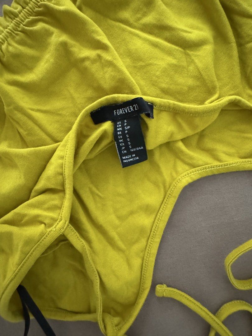 Forever 21 Mustard Yellow Crop Top Size S (Category: Sleeveless) located in Manila. Submitted by maliwana.gan (Listing ID 1467029477, Image 3). Description: Fits XS to S Loc: Tomas Morato, QC Lalamove c/o buyer - Brand: Forever 21 - Color: Bright lime green - Size: Small (true to size) - Material: Soft cotton blend - Details: Spaghetti straps, stretchy gathered hem - Condition: Excellent, no major flaws - Perfect for: Summer days out and casual w