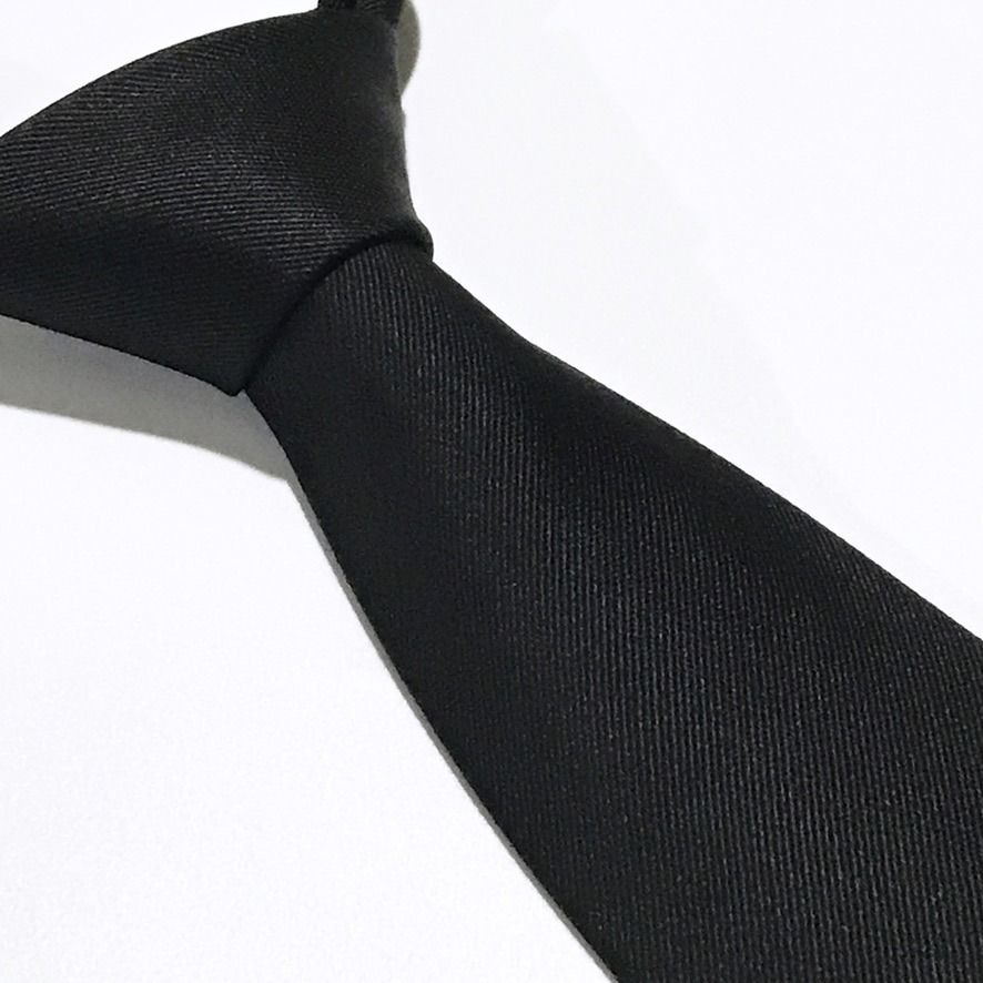 Formal Matte Solid Black Neck Tie (Category: Ties) located in Taguig. Submitted by retrogaze (Listing ID 1466976815, Image 1). Description: This 100% silk necktie by Formal is crafted in solid black with a refined, matte-finish diagonal twill weave. Clean, understated, and unadorned, the tie presents a subtle, understated texture that absorbs light for a deep, rich black presentation. Brand Overview: Formal (Original Cravat) is a Japanese formalw