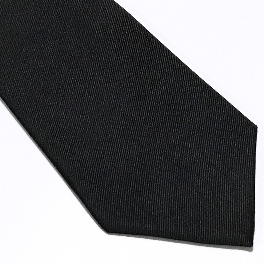Formal Matte Solid Black Neck Tie (Category: Ties) located in Taguig. Submitted by retrogaze (Listing ID 1466976815, Image 2). Description: This 100% silk necktie by Formal is crafted in solid black with a refined, matte-finish diagonal twill weave. Clean, understated, and unadorned, the tie presents a subtle, understated texture that absorbs light for a deep, rich black presentation. Brand Overview: Formal (Original Cravat) is a Japanese formalw