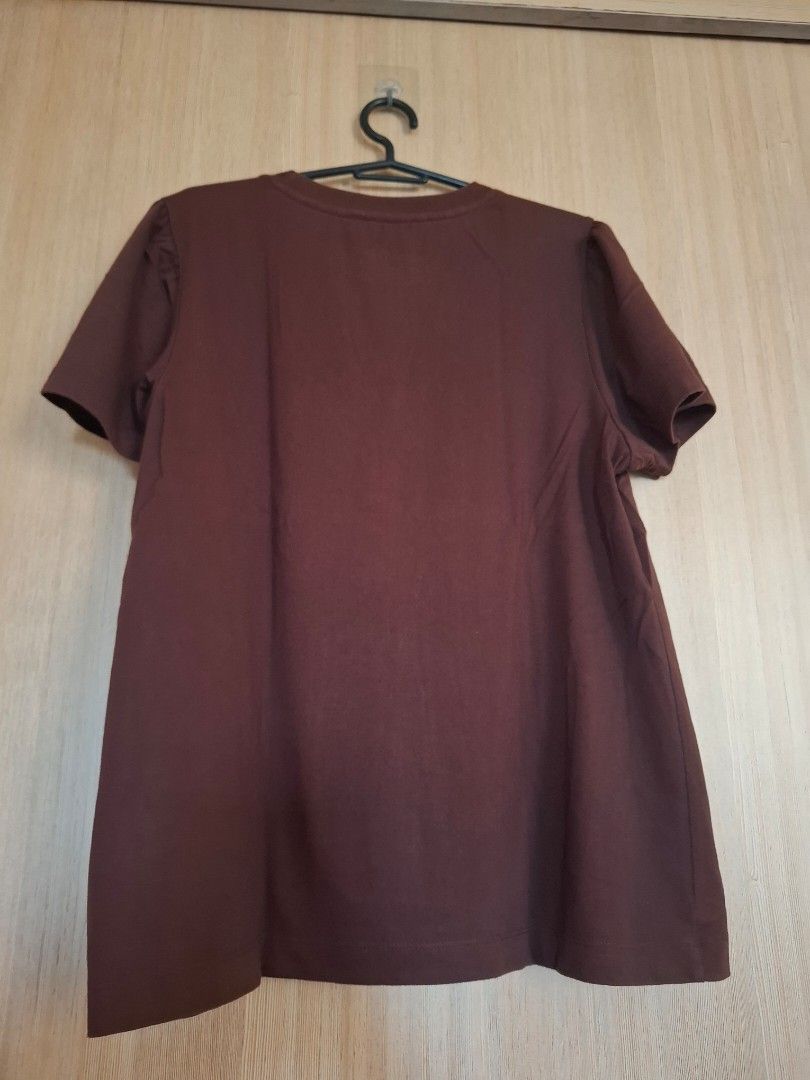 Forme Brown Blouse (Category: Shirts) located in Rizal. Submitted by mirisica (Listing ID 1467136688, Image 2). Description: - Brand: Forme - Size: Large - Color: Brown - Design: Rhinestone 'forme' script graphic on chest, plain back - Fit/Style: Short sleeves, classic crew neck, comfortable everyday fit - Material: Soft cotton - Condition: Good condition.