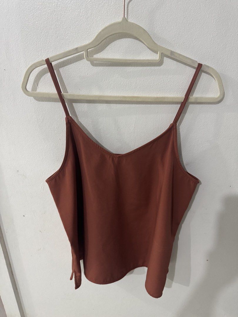 Forme Brown Spaghetti Strap Cami Top Size L (Category: Sleeveless) located in Pasig City. Submitted by pmlmri (Listing ID 1467155929, Image 3). Description: - Brand: For me - Item: Brown cami top - Size: L / EUR 40 / UK 12 - Details: Thin spaghetti straps, v-neckline, simple casual style - Condition: Clean, no stains or damage - Origin: Made in the Philippines Mode of Shipping: J&T or Lalamove Mode of Payment: Gotyme/BPI/Gcash .