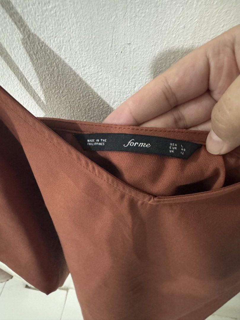 Forme Brown Spaghetti Strap Cami Top Size L (Category: Sleeveless) located in Pasig City. Submitted by pmlmri (Listing ID 1467155929, Image 2). Description: - Brand: For me - Item: Brown cami top - Size: L / EUR 40 / UK 12 - Details: Thin spaghetti straps, v-neckline, simple casual style - Condition: Clean, no stains or damage - Origin: Made in the Philippines Mode of Shipping: J&T or Lalamove Mode of Payment: Gotyme/BPI/Gcash .