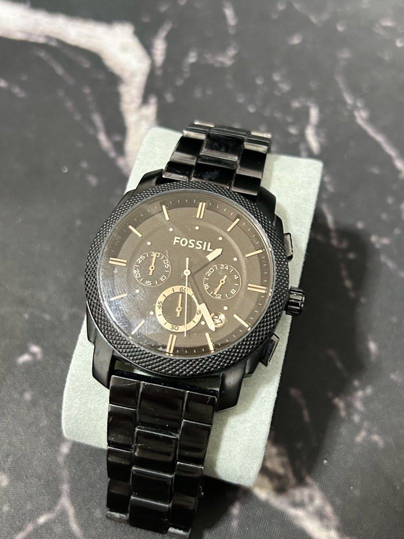 Fossil chronograph watch bundle with three distinct styles (Category: Men's Watches) located in Manila. Submitted by jehielash (Listing ID 1467018424, Image 2). Description: Three Fossil watches included in this lot. One features a rose gold case with white dial and brown leather strap. Another has a black textured bezel with dark dial and black link bracelet. The third is silver tone stainless steel with crystals around the bezel, white mother-o