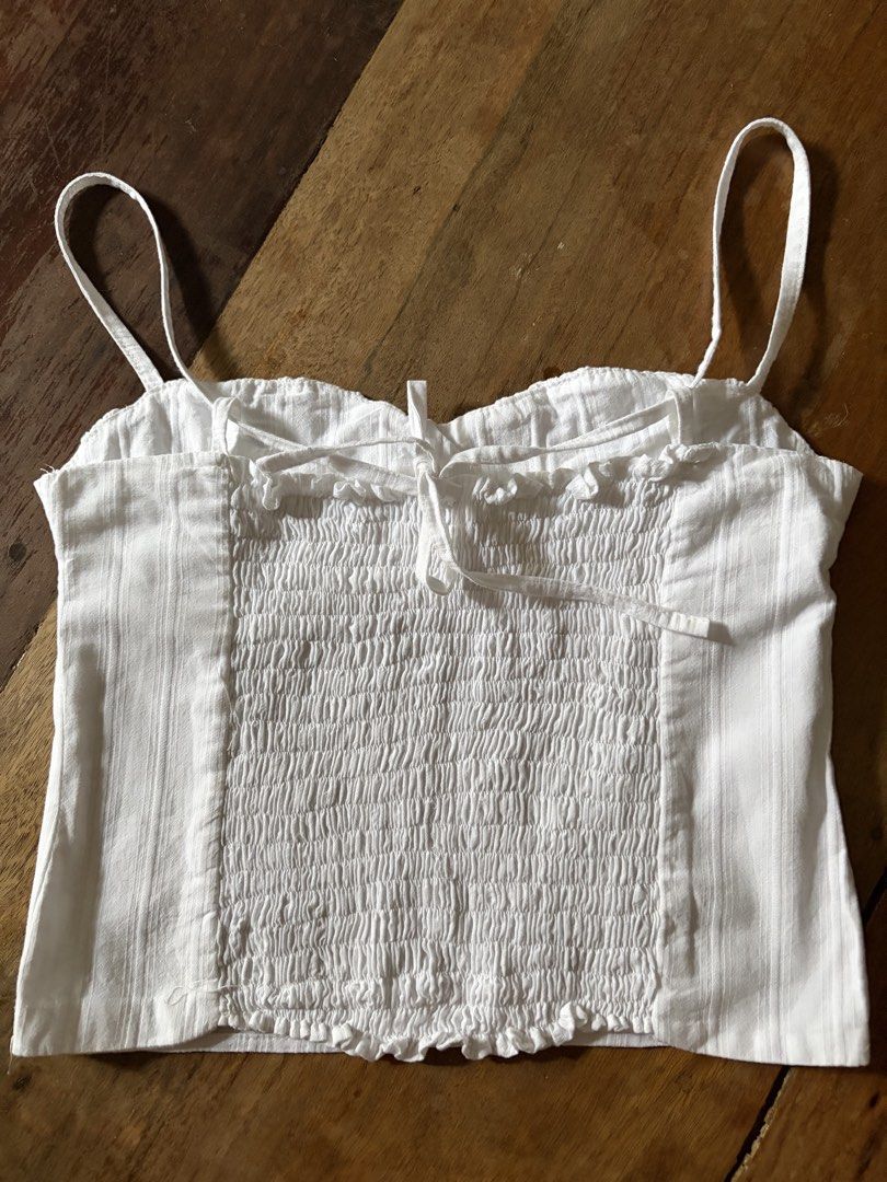 Frances Top in Shell White, Isa the label (Category: Sleeveless) located in Pasig City. Submitted by luxurypreloved12 (Listing ID 1467032111, Image 3). Description: selling my preloved frances top in crisp white mint condition! 🤍 worn 2x lost some weight so it doesnt fit me so well anymore. **posted items r available unless stated otherwise** - size L on tag but fits better S - smaller L frames. Fit is smaller - absolutely NO lowballers lp or jo