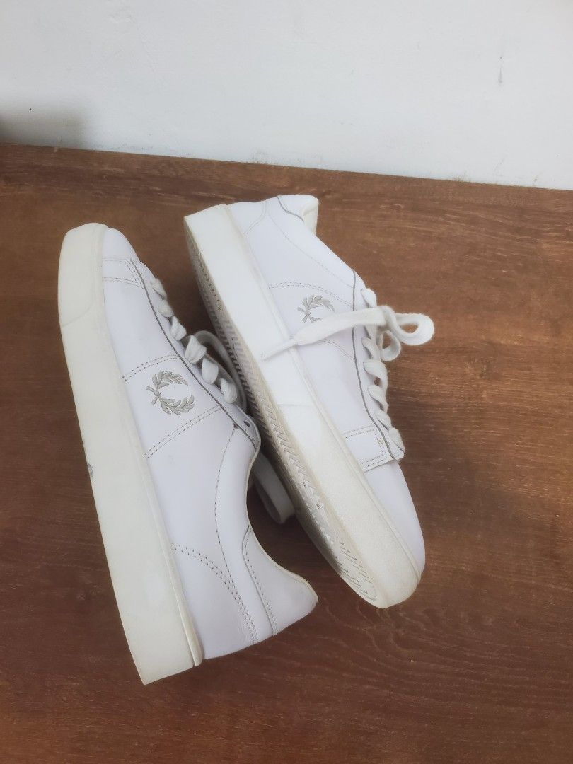 Fred Perry white leather sneakers size UK 5 (Category: Sneakers) located in Manila. Submitted by royalrabbit.7b2a11 (Listing ID 1467029314, Image 1). Description: - Brand: Fred Perry - Style: Clean minimal white leather sneakers with classic embroidered laurel wreath and chunky soles - Size: UK 5 / EU 38 / US 7 - Condition: Normal signs of wear on soles and uppers - Perfect classic everyday casual shoes.