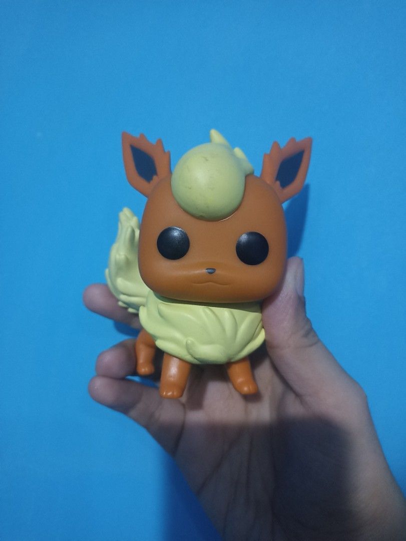 Funko Pop: Pokemon - Flareon (no box) (Category: Figurines & Statues) located in Manila. Submitted by hobbymo_koleksyon.ph (Listing ID 1467073520, Image 1). Description: - Authentic Pokemon Flareon Funko Pop figure - Loose item, no original box included - Made of clean vinyl with minor surface dust from display - Features iconic orange-brown body, fluffy cream mane/tail, and big black eyes - Stands upright on its own - Includes official copyright
