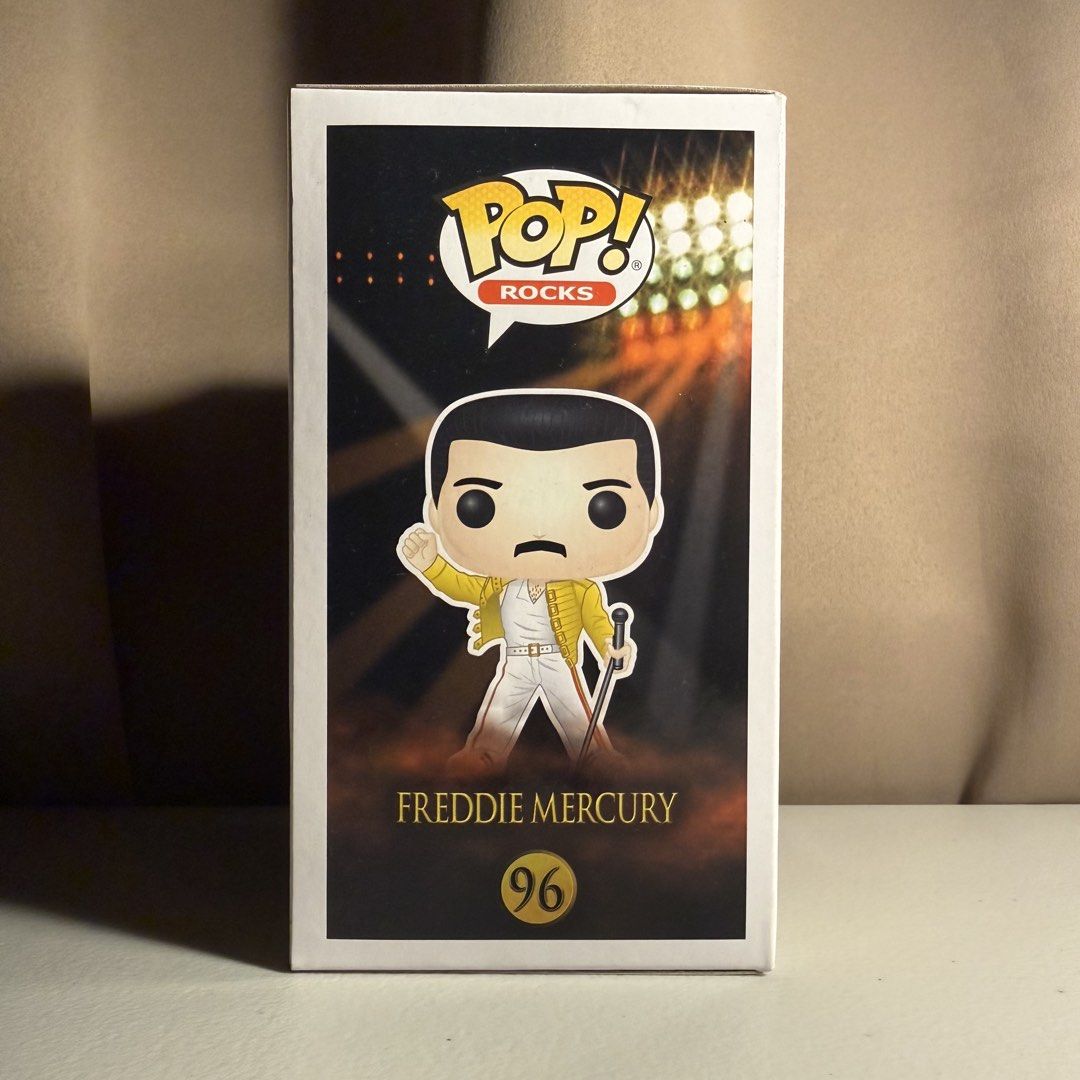 Funko Pop! Rocks: Queen – Freddie Mercury (#96) (Category: Figurines & Statues) located in Manila. Submitted by cheemkenn (Listing ID 1467158975, Image 2). Description: Funko Pop! Rocks: Queen – Freddie Mercury (#96) Selling authentic Funko Pop! Rocks vinyl figure featuring the legendary Freddie Mercury in his iconic yellow jacket outfit from Queen's 1986 Wembley Stadium performance. A iconic centerpiece for Funko Pop collectors or music fans! It