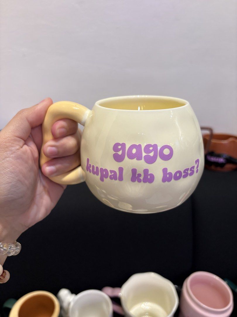 Funny statement ceramic mug Filipino novelty mug (Category: Coffee & Tea Tableware) located in Makati City. Submitted by chaflores02 (Listing ID 1467068443, Image 1). Description: - Heavy-duty ceramic mug with bold, colorful Pinoy quotes and expressions - Perfect conversation starter for your morning coffee or office desk setup - Available in 5 relatable designs: 'tangina, not today', 'naknampucha', 'gago kupal kb boss?', 'shutacca shutacca', and